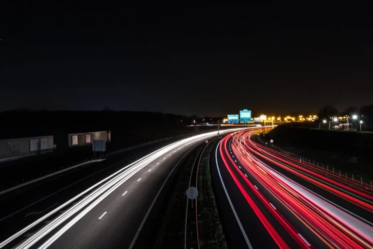 Long exposure of cars on a highway at night.